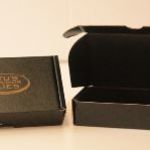 Die Cut Box with Hinged Locking Lid - Roller Coated Black 2 sides with Gold Screen Print 